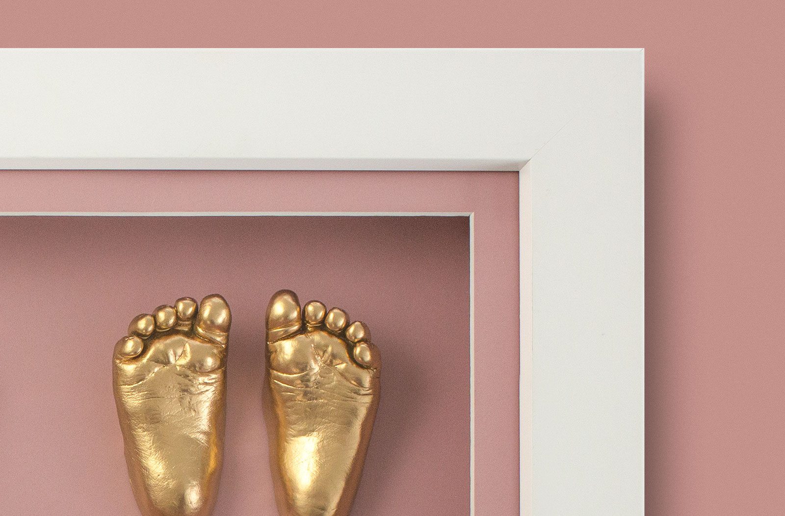 Framed gold baby feet casting
